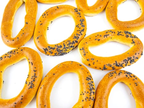 Bagels with poppy seeds on a white background. Drying. Food photo.