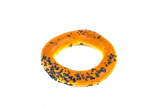 Bagels with poppy seeds on a white background. Drying. Food photo.