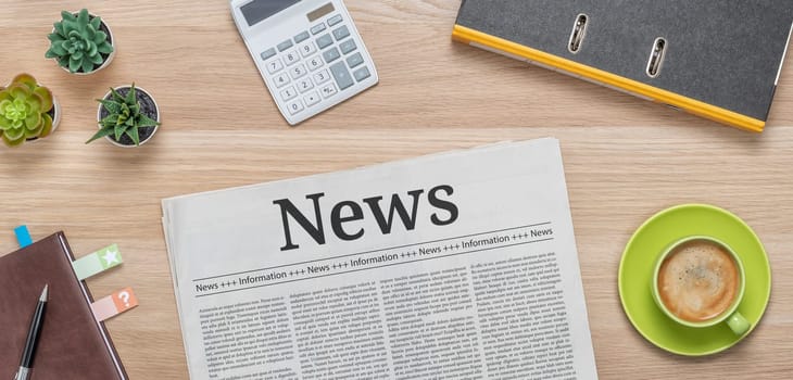 A newspaper on a desk with the headline News
