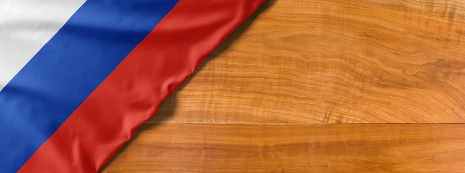 National flag of Russia on a wooden background with copy space
