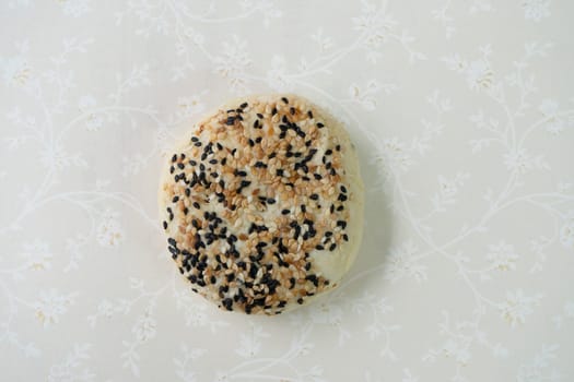 Chinese moon cake or pastry with sesame on top.