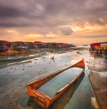 Beautiful view of sunrise at Penang. Boat on the foreground.  Malaysia