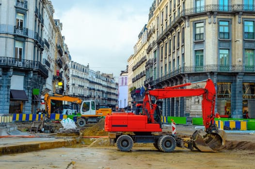 Cityscape with excavators working at renovation of downtown street, Brussels, Belgium