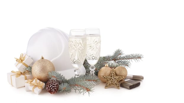Construction hard hat, fir tree branches, two glasses with champagne, gift boxes and Christmas ornament isolated on a white background. New Year and Christmas construction background