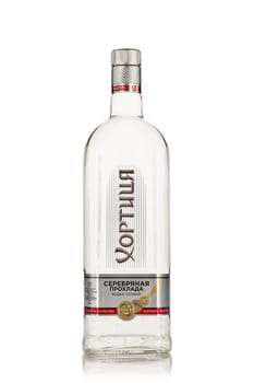 St.Petersburg, Russia - May 2019 - Bottle of vodka Khortytsa Platinum on a white background with reflection. Premium vodka.
