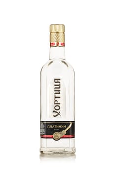 St.Petersburg, Russia - May 2019 - Bottle of vodka Khortytsa Platinum on a white background with reflection. Premium vodka.