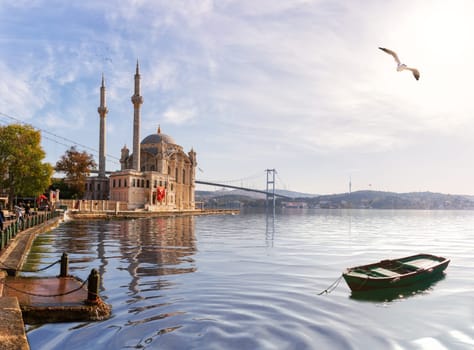 Ortakoy Mosque and the boat, beautiful view from the pier, Istanbul.