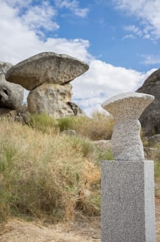 Senses route at Natural Monument of Los Barruecos. Track suitable for blind people Scale models of Mushroom-shaped granite formation, Caceres, Spain