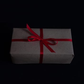 craft gift box with bow knot on dark background