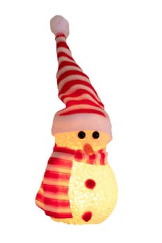 Christmas snowman isolated. Close-up of a yellow illuminated happy cute winter snowman with red white striped hat and scarf isolated on a white background. Macro photograph.