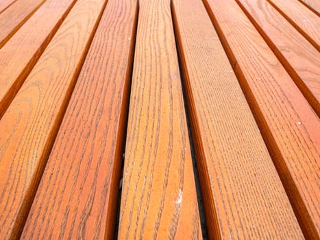 Wooden background from varnished boards. Place for text.