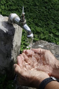 SALVADOR, BAHIA / BRAZIL - September 27, 2013: Faucet pours the last drops of water due to lack of supply.