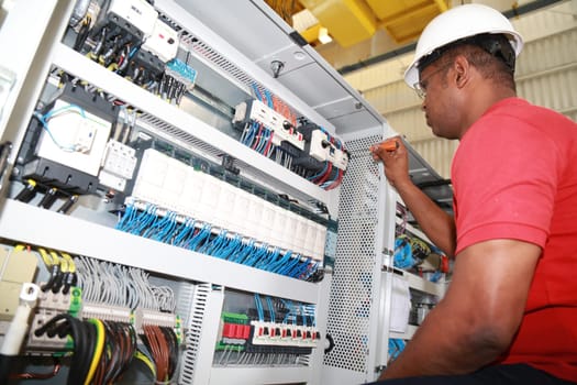 SIMOES FILHO, BAHIA / BRAZIL - May 13, 2015: Acciona Windpower wind turbine factory employees are seen working. (Joa Souza / Panthermedia).