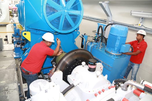 SIMOES FILHO, BAHIA / BRAZIL - May 13, 2015: Acciona Windpower wind turbine factory employees are seen working. (Joa Souza / Panthermedia).