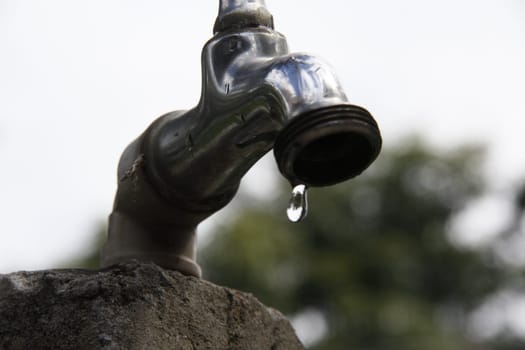 SALVADOR, BAHIA / BRAZIL - September 27, 2013: Faucet pours the last drops of water due to lack of supply.