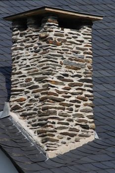 Beautiful brick chimney in stone