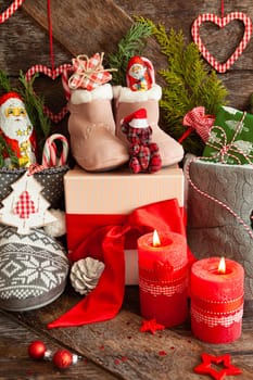 Knitted boots with little presents and candy for Christmas
