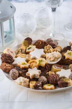 Festive Christmas table with assorted Christmas homemade cookies with ornaments