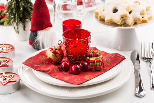 Christmas And New Year Holiday Table Setting. Celebration. Place setting for Christmas Dinner. Holiday Decorations. Decor.