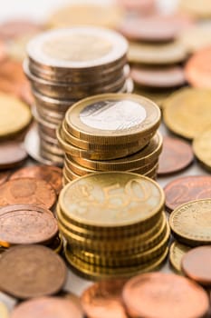 Piles of Euro coins . Money.