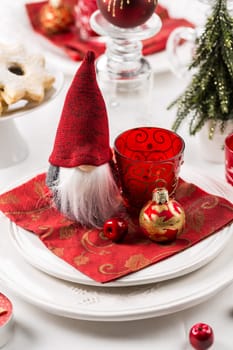 Christmas And New Year Holiday Table Setting. Celebration. Place setting for Christmas Dinner. Holiday Decorations. Decor.