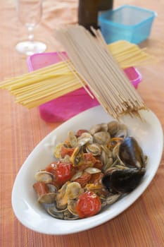 sautè of clams and mussels in a serving dish.
