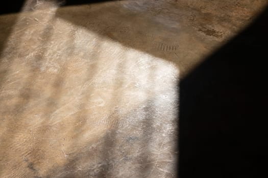Abstract background of sunlight and shadows on the floor, stock photo