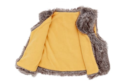 Fur vest. A brown fur vest with yellow wool lining fabric for the little girl isolated on a white background. Child spring and autumn fashion.