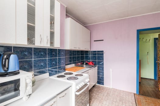 Russia, Moscow- July 02, 2019: interior room apartment. standard repair decoration in hostel. modern kitchen, dining area