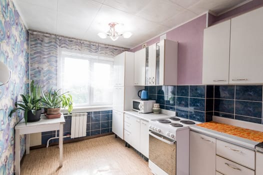 Russia, Moscow- July 02, 2019: interior room apartment. standard repair decoration in hostel. modern kitchen, dining area