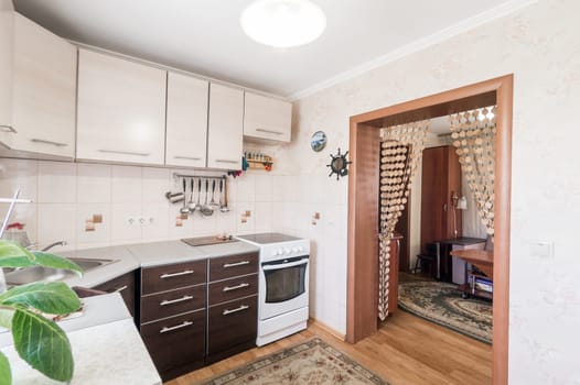 Russia, Moscow- July 01, 2019: interior room apartment. standard repair decoration in hostel. modern kitchen, dining area