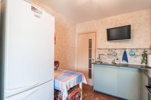 Russia, Moscow- July 01, 2019: interior room apartment. standard repair decoration in hostel. modern kitchen, dining area
