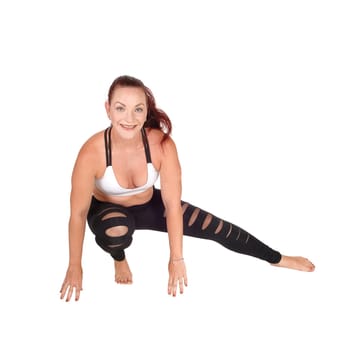 A woman in exercise outfit crouching on the floor doing her workout,.isolated for white background.