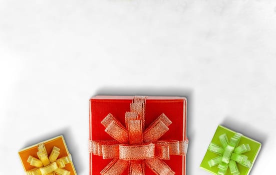 Colorful gift box with a ribbon on the floor