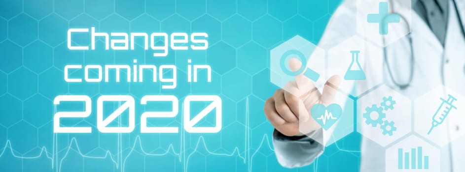Doctor touching an icon on a futuristic interface - Changes coming in 2020