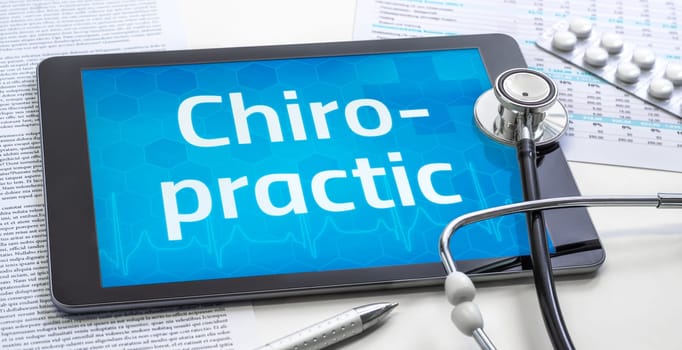 The word Chiropractic on the display of a tablet