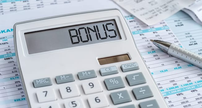 A calculator with the word Bonus on the display