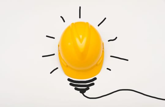 Concept idea with safety helmet light bulb isolate on white background