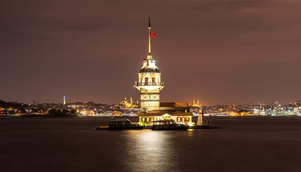The Maiden's Tower and night lights of Istanbul, Turkey.