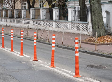Striped traffic stops on the road. Transport.