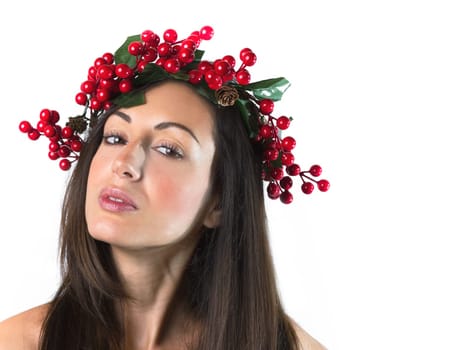 Smiling young woman with wearing a Christmas wreath on her head. Natural makeup. Christmas or New Year beauty woman portrait isolated on white background.