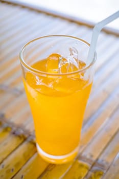 Glass water drink cool with tube on table blurred background