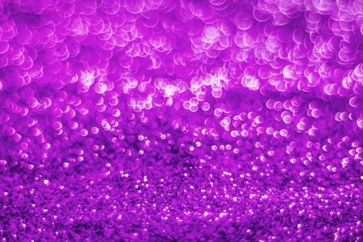 Glitter light abstract purple bokeh christmas light blurred background