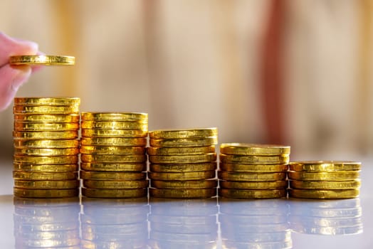 Save money and account banking for finance business concept, Hand with coin money on blurred background