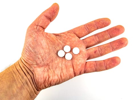 Medical pills in hand on a white background. Place for text. Medicine and health.