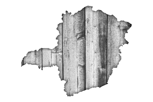 Map of Minas Gerais on weathered wood