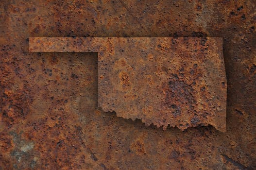 Map of Oklahoma on rusty metal