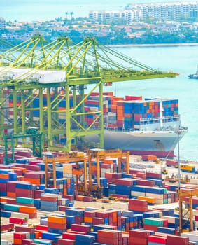 International commercial port of Singapore, ships, colorful cargo containers, freight cranes