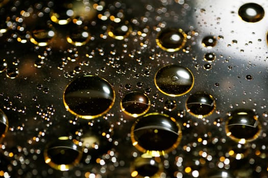 Golden oil bubbles macro on water background with bokeh fifty megapixels prints