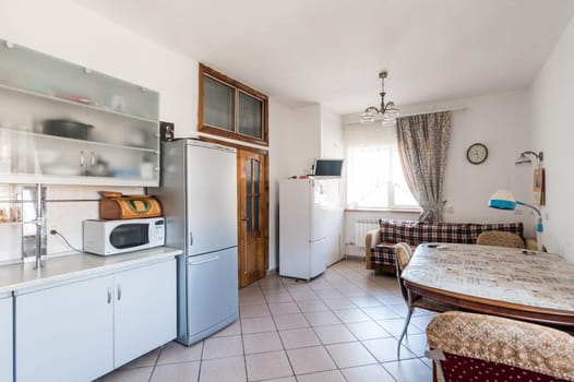 Russia, Moscow- July 06, 2019: interior room apartment. standard repair decoration in hostel. kitchen and dining room